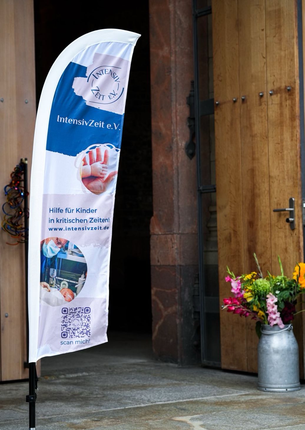 hand of an adult holds hand of a baby